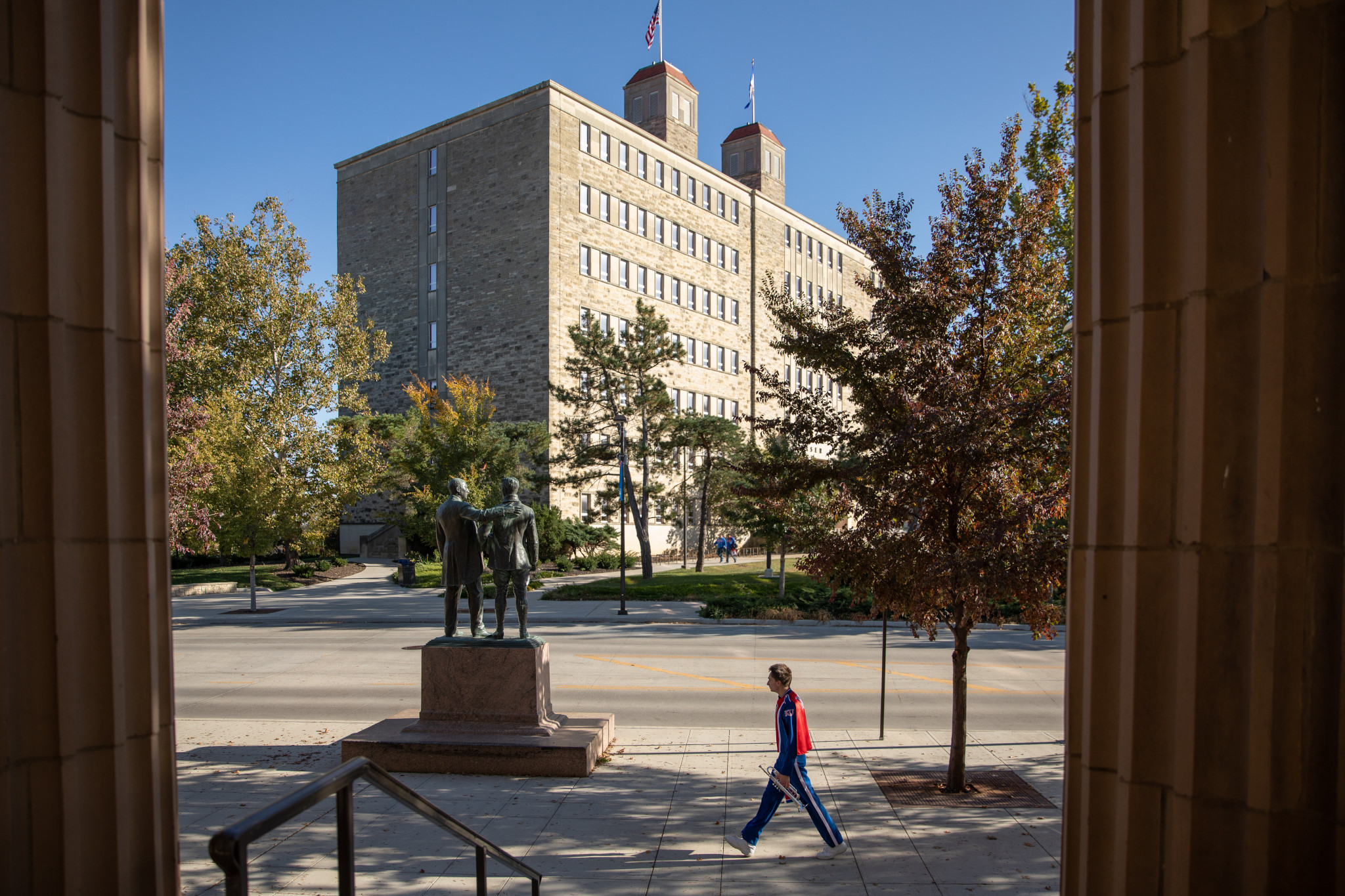 fraser hall framed by the columns of a building
