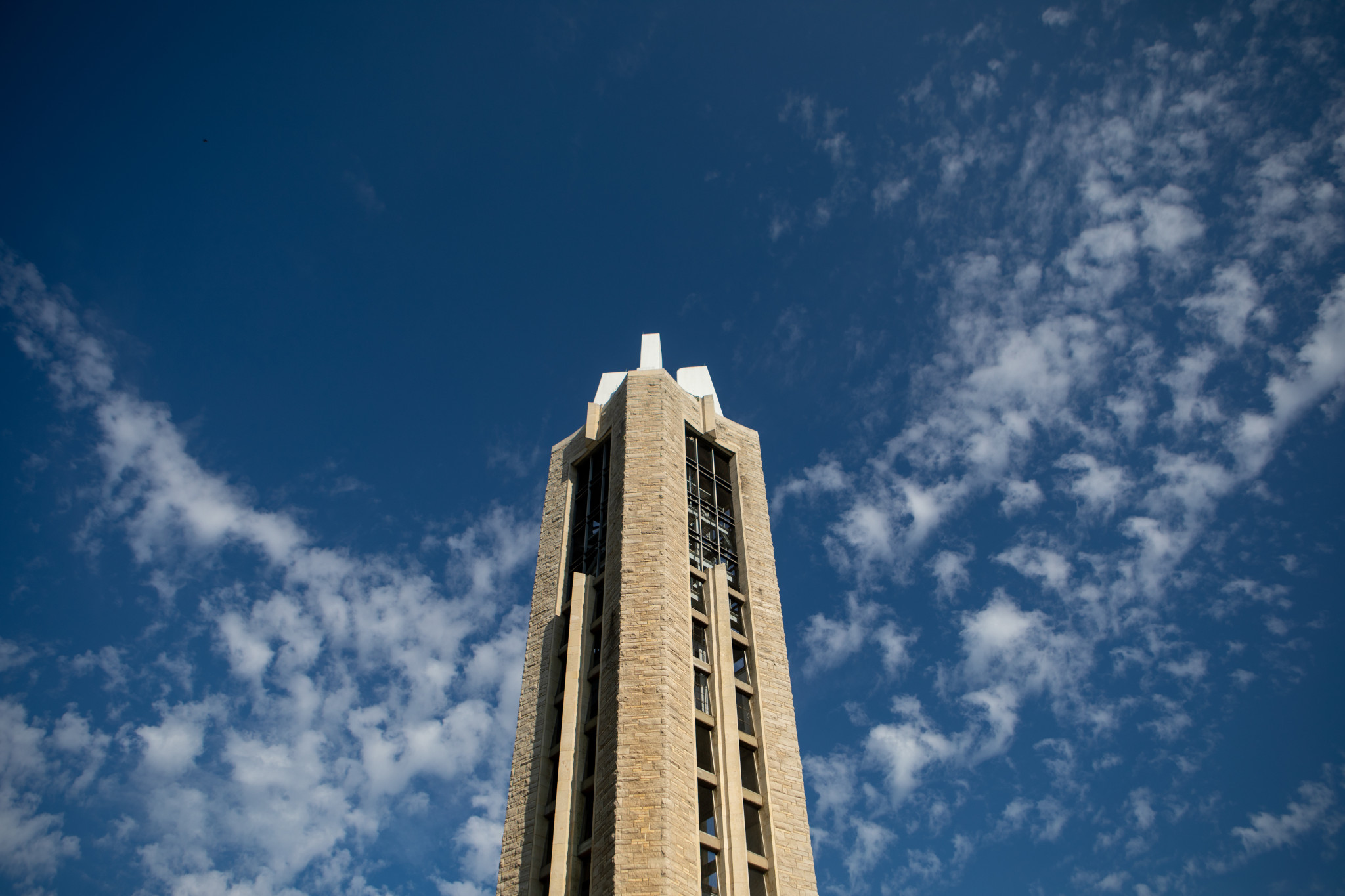 campanile with blue sky and a few clouds